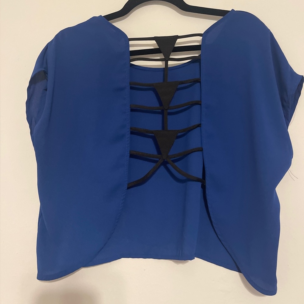Fits like Large- blue crop top with open back with black design